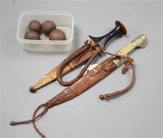 Two Eastern daggers and four canon balls